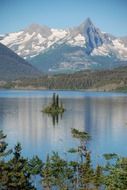 tiny island on the mountain lake, glacier national park, montana, america