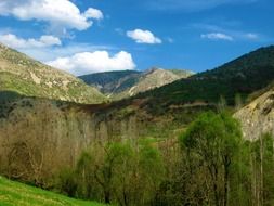 green mountains under the blue sky