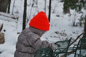 portrait of child in red hat in winter