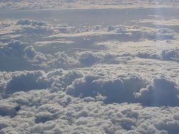 snow-white clouds under the bright sun