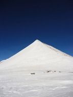 High snowy mountain at blue gradient sky background in France
