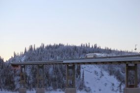winter mountain and road bridge scene