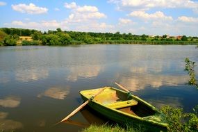 wooden boat on the water on the lake