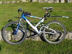 Bike on a support on a green meadow