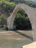 ancient stone bridge over the river