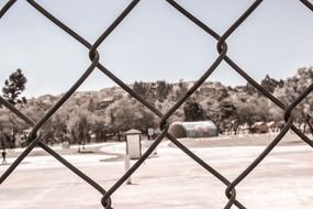 view of the park through the fence