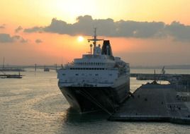 big white liner at sunset