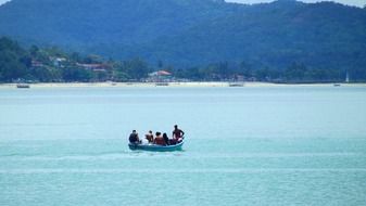 fishermen in a rowing boat in the ocean