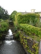 cascading creek among fields in summer