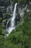waterfall in gray mountains in Austria