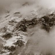 Black and white photo of the beautiful mountains of Switzerland in snow