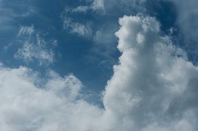 white clouds in blue sunny sky