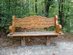 wooden carved bench in a park
