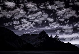 mountains peaks in the clouds