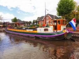 colorful boat on water in netherlands village