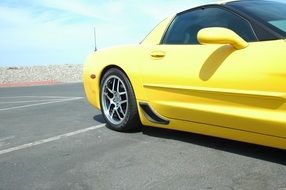 Side view of a yellow Corvette