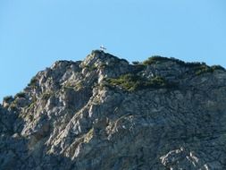 cross on top of a mountain in hausberg