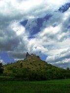 distant view of the castle on the green mountain