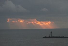 sunrise behind the clouds on the horizon