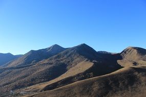 Landscape with the mountains under the blue sky