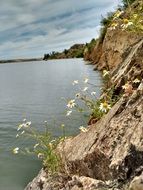 rocky shore of fishing lake