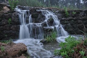 water flow on river stones scene