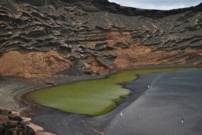 green lake in gorgeous volcanic landscape, spain, canary, lanzarote