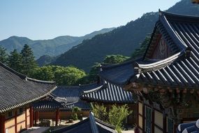 Asian houses in front of mountain landscape, South Korea, hapcheon