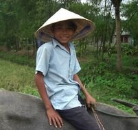 boy on a buffalo in the countryside in vietnam