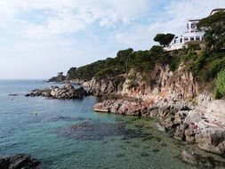 Beautiful coastal panorama with plants and buildings in Palafrugell, Spain