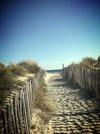 path along the wooden fence to the beach in montpellier