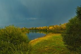 rainy sky over the river in autumn