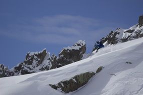skiing person on snowy mountain side
