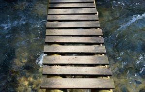 wooden bridge over creek