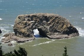 rock formation like an arch on the coast in oregon