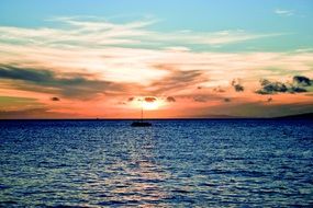 boat on the lake at red sunset