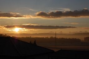 beautiful sunrise outside the city in the yellow twilight