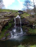 small waterfall near the river