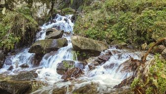 waterfall among large stones close-up