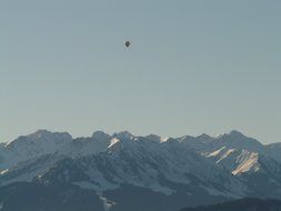 balloon soars over the Alps