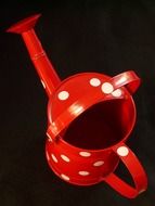 red watering can