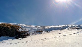 landscape of snowy mountains at sunny day