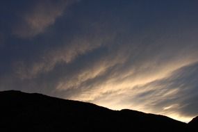 clouds in evening sky mountain scene