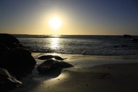 sunset over the ocean at dusk