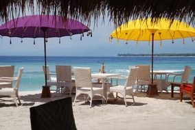 bright umbrellas on bali beach