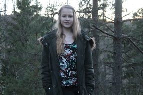 portrait of a blonde girl in the forest