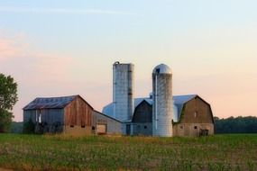 photo of farmhouse and barn on the field