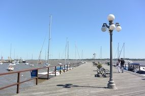 wooden pier with lanterns