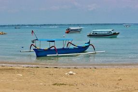 blue boat on the beach in bali