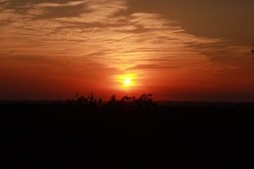 red rays of sunset on the sky
